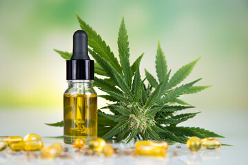 Cbd hemp oil in bottle and marijuana leaves