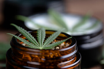 Cbd hemp cosmetics, oil in bottle and marijuana
