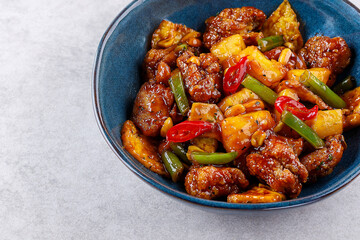 fried chicken with pineapple in sweet and sour sauce