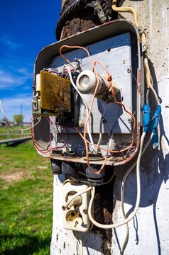 Abandoned electrical box with various wires and devices