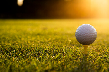 Closeup Golf ball on green grass on course