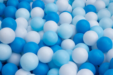 A pile of blue and white balls
