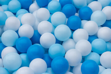 A pile of blue and white balls
