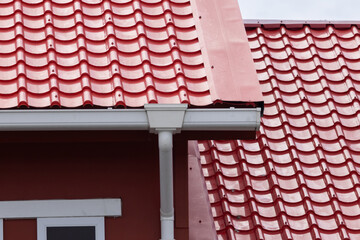 A red roof with a white gutter