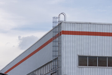 A large building with a ladder on the side