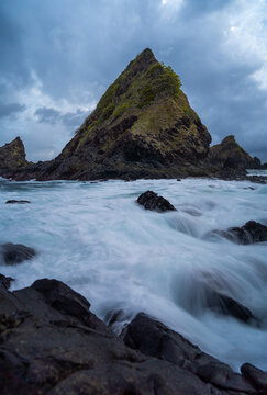 dramatic coastal scene  with rocky cliffs and waves