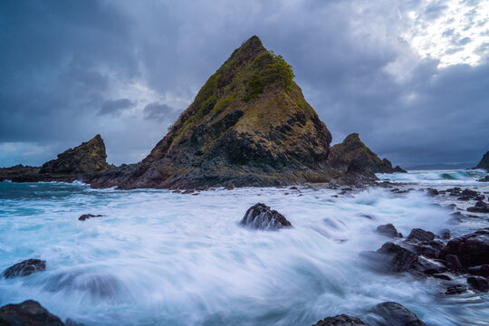 dramatic coastal scene  with rocky cliffs and waves