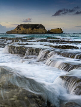 dramatic coastal scene  with rocky cliffs and waves