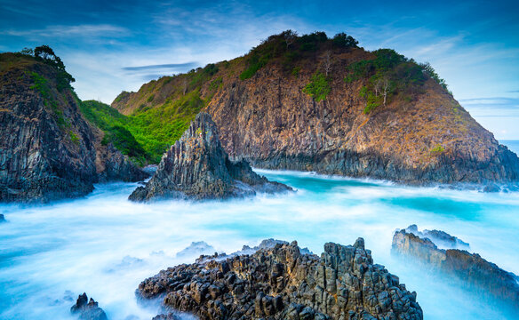dramatic coastal scene  with rocky cliffs and waves