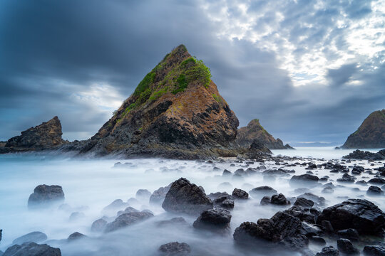 dramatic coastal scene  with rocky cliffs and waves