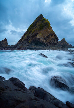 dramatic coastal scene  with rocky cliffs and waves