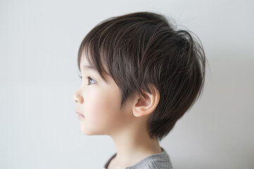 side profile of young asian boy with calm expression