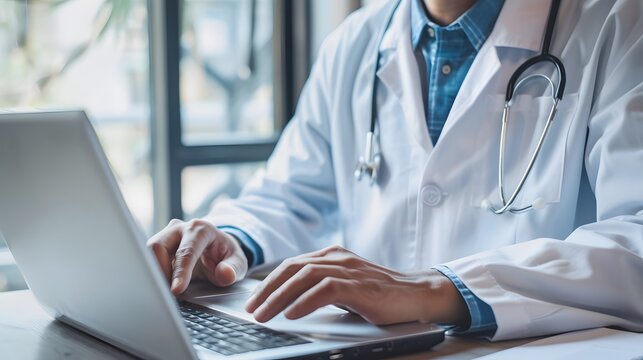 A professional doctor in a virtual consultation, discussing with a patient via laptop.