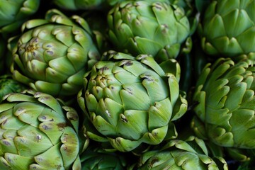 Fototapeta premium Farmers Market Closeup. Fresh Artichokes, Healthy Green Vegetable at Market