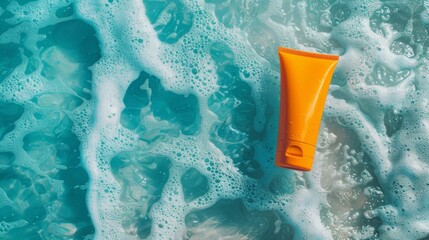 An orange tube floats amidst blue, foamy water, creating a visually captivating and refreshing scene, ideal for concepts related to relaxation, personal care, and summer vibes.