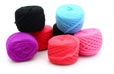 Different color balls of threads wool yarn isolated on white background
