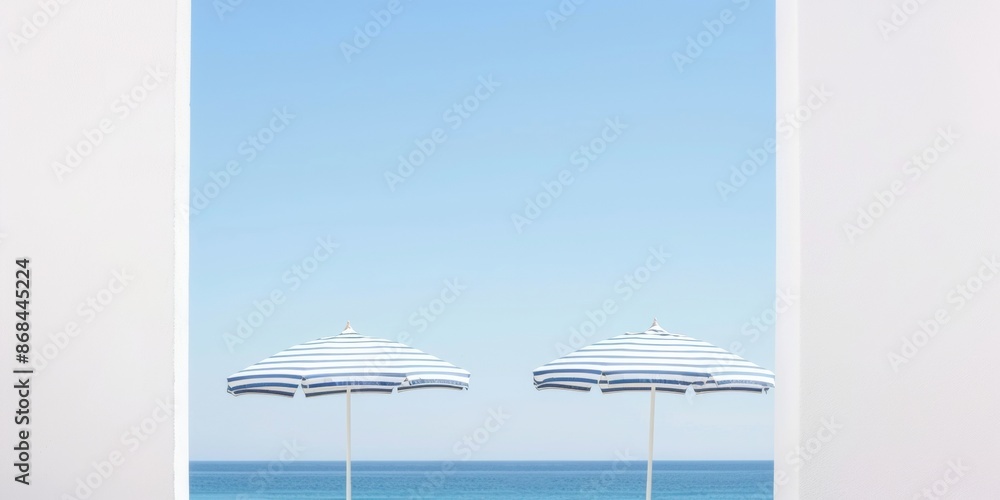 Aufkleber Symmetrical Abstract Summer Vibes Dual Striped Beach Umbrellas Against a Clear Blue Sky, Utilizing Long Exposure and Wide-Angle Lens
