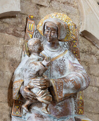 ASSISI, ITALY - MAY 17, 2024:  The ceramic statue of Madonna in the church Chiesa di San Pietro by...