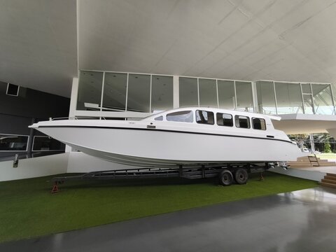 The modern boat on the stand in the showroom