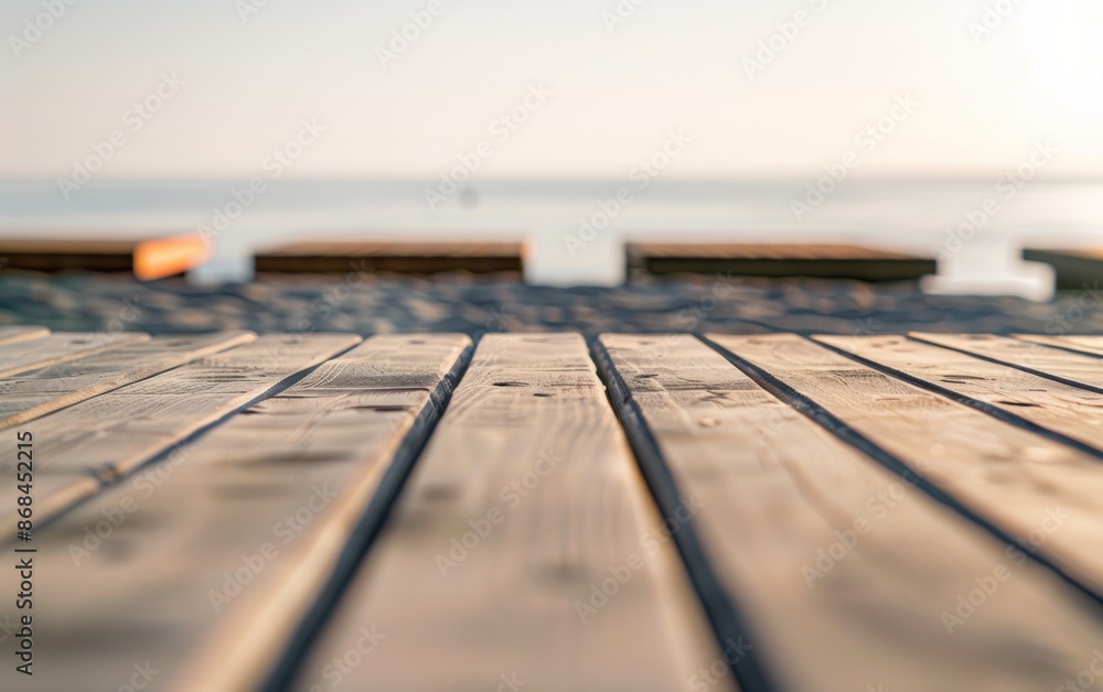Aufkleber serene summer beach scene with empty sandy wooden table in foreground for product display, bright su