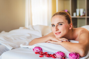 Beautiful happiness young attractive Caucasian woman having body massage by Thai Masseur in spa salon. Beauty treatment and body care lifestyle concept	