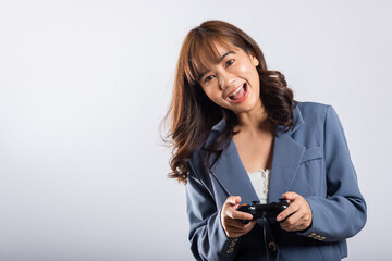 Asian happy portrait beautiful business woman wearing a suit smile lifestyle games technology her holding joystick game playing on hands on white background with copy space for text, Relaxation time © sorapop