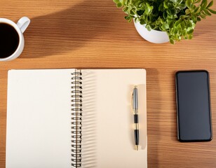 テーブルに置かれたスマホとコーヒーとノート