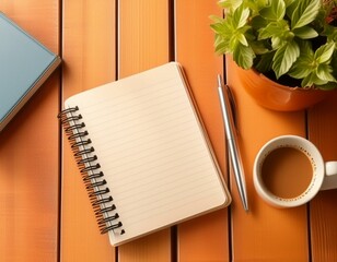 テーブルの上で開かれたリングノートと傍らに置かれたコーヒー