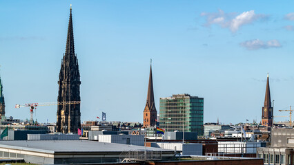 Modern Urban Skyline with Clouds, St. Nicholas' Church
