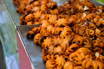 fried octopus on a counter in a street cafe, Thailand