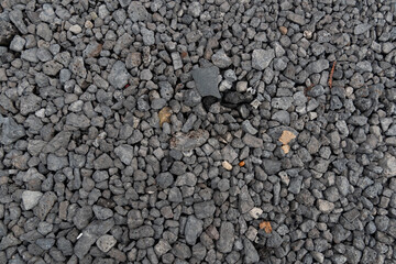 Pile of grey crushed stone. Abstract background and texture for design.