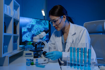 scientist is using microscope in laboratory, chemical researcher works in chemistry with...