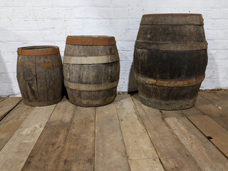 Old wine barrels, casks in historic farm building with hardwood floors, near town of Toodyay, Wheatbelt region, Western Australia