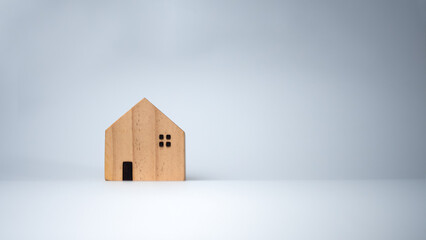 Wooden houses on a white background, It is placed in front of each other, The concept of buying and selling real estate, Rental and investment in real estate.