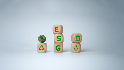 Environment Social Governance Concept, Wooden block with the letters ESG and Symbol on it. The block is placed on top of a white background, Concept of sustainability and environmental responsibility.