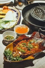 Deep-fried red tilapia with curry sauce, a Thai food concept.