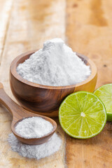 Baking soda and lime on a wooden surface