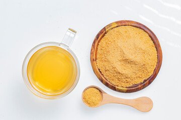 Drink of piloncillo and ground piloncillo, on white background