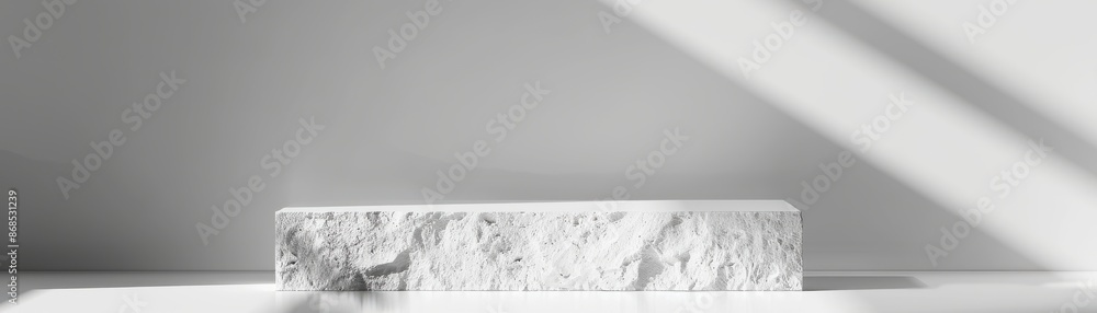 Poster elegant marble display pedestal illuminated by soft natural light with shadows, creating a minimalis