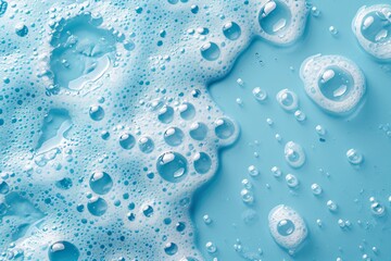 White soap foam with bubbles texture on blue background. Detergent foam bubble on water, soap sud. Face cleansing mousse smudge, shower gel, hair shampoo foam smear texture. Beauty, clean and laundry 