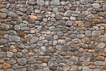 Stone wall in an old abandoned and ruined house
