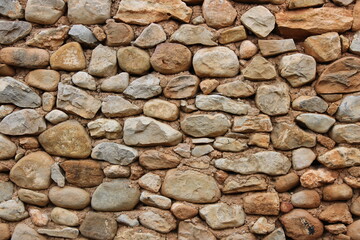 Stone wall in an old abandoned and ruined house