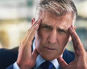 Portrait, mature and businessman in office with headache, tension and stress for project. Ceo,...