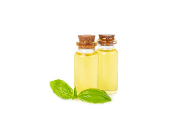Basil essential oil isolated on white background. Basil essential oil and fresh leaves. Aromatherapy. Aroma oil. Medical herbs. Alternative medicine. Place for text. Copy space.