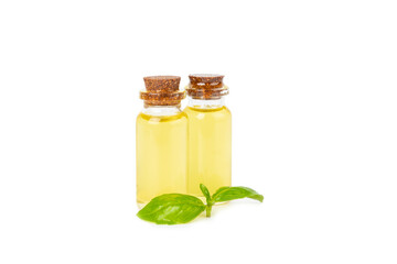 Basil essential oil isolated on white background. Basil essential oil and fresh leaves. Aromatherapy. Aroma oil. Medical herbs. Alternative medicine. Place for text. Copy space.