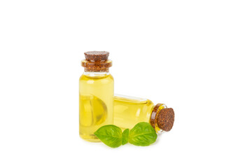 Basil essential oil isolated on white background. Basil essential oil and fresh leaves. Aromatherapy. Aroma oil. Medical herbs. Alternative medicine. Place for text. Copy space.