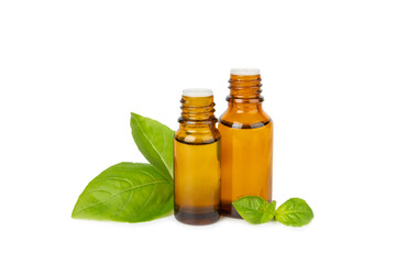 Basil essential oil isolated on white background. Basil essential oil and fresh leaves. Aromatherapy. Aroma oil. Medical herbs. Alternative medicine. Place for text. Copy space.