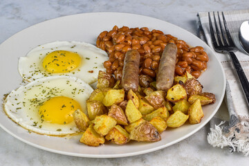 fried eggs  with sausage and beans