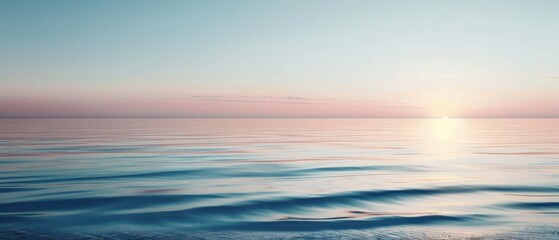 Obraz premium The ocean is calm and the sky is a beautiful shade of pink