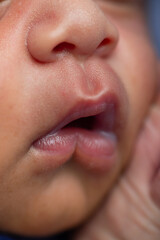 Newborn human baby tiny little lips mouth